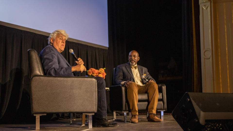 Jay Leno and Donald Osborne on stage as part of the Audrain Newport Concours & Motor Week.