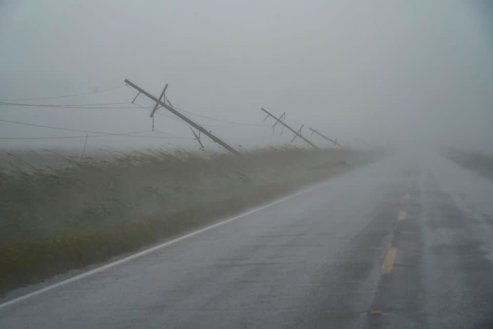 Utility poles damaged by Hurricane Laura are seen as Hurricane Delta approaches.