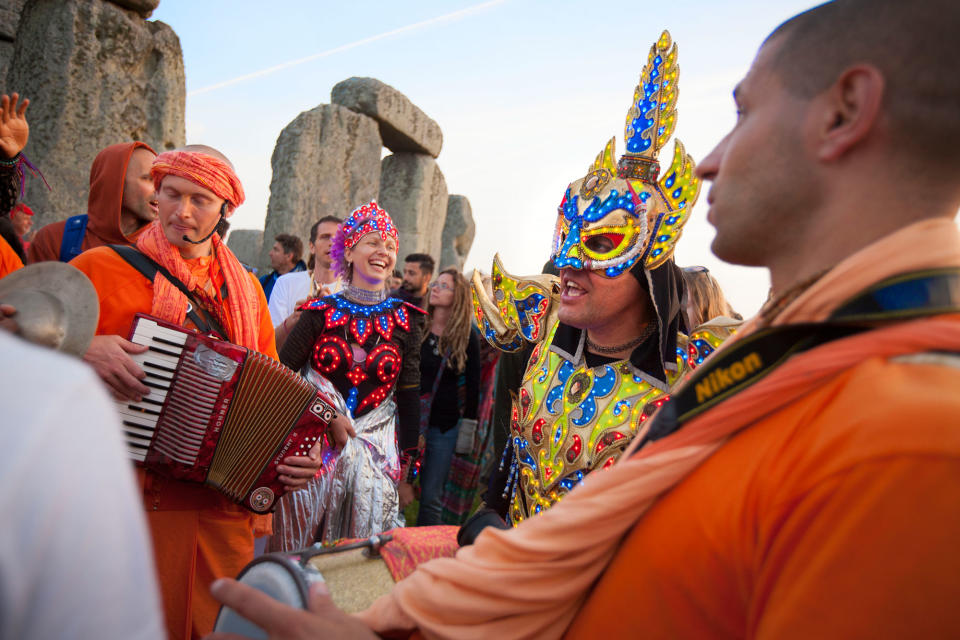 <p>Revellers celebrate summer solstice and the dawn of the longest day of the year at Stonehenge on June 21, 2017 in Wiltshire, England. (Photo: Kiran Ridley/Barcroft Images/Barcroft Media via Getty Images) </p>