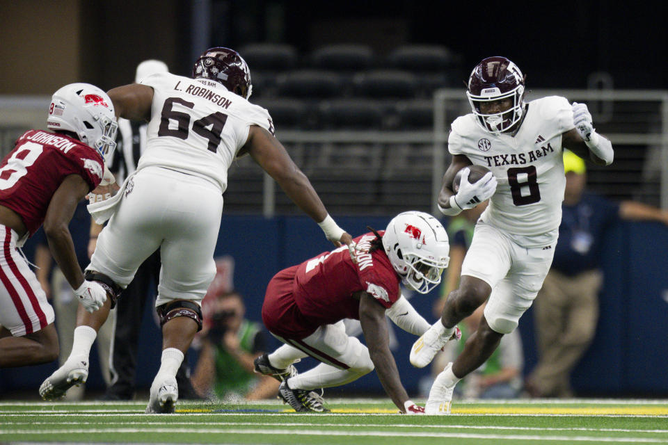 Sep 30, 2023; Arlington, Texas; Texas A&M Aggies running back Le'Veon Moss (8) runs with the ball against the Arkansas Razorbacks during the first half at AT&T Stadium. Jerome Miron-USA TODAY Sports