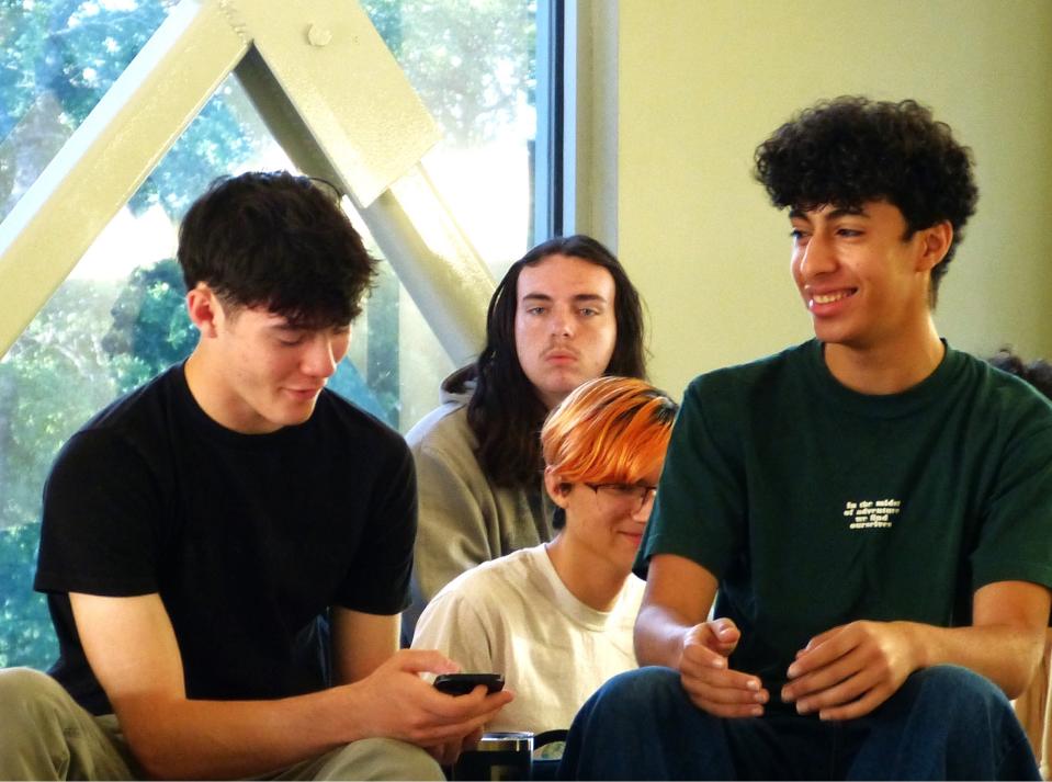 Gracen Mayes, 16, left, and Ali Aljamal enjoy some free time before classes at Redding School of the Arts on Wednesday, April 17, 2024. Aljamal is a foreign exchange student from Gaza.