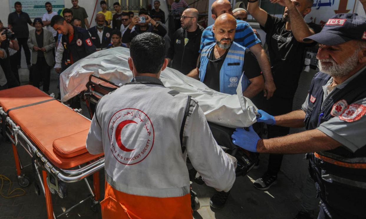 <span>The body of one of the seven World Central Kitchen workers is prepared in Rafah to be returned to their home country.</span><span>Photograph: Ahmad Hasaballah/Getty Images</span>