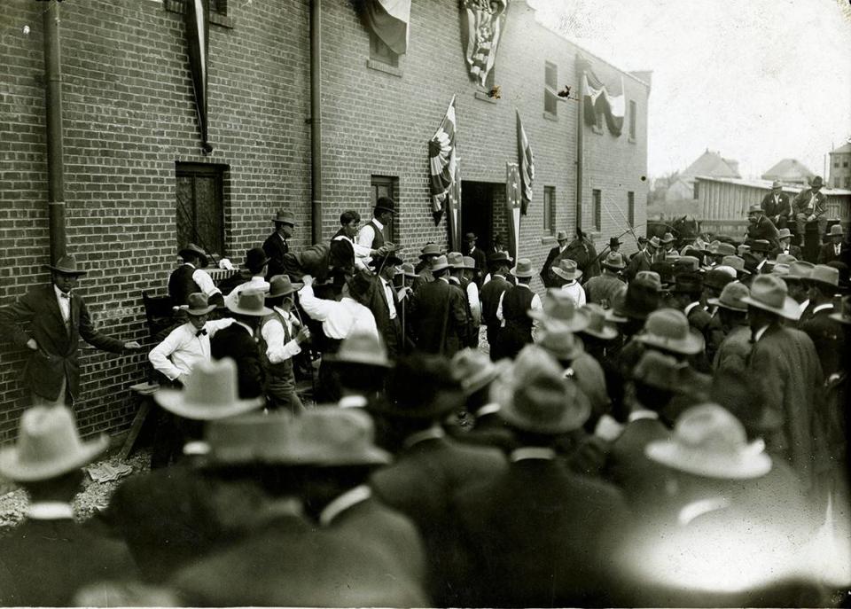 Auctioneering in Mule Alley at the Fort Worth Stockyards horse and mule barns, date unknown.