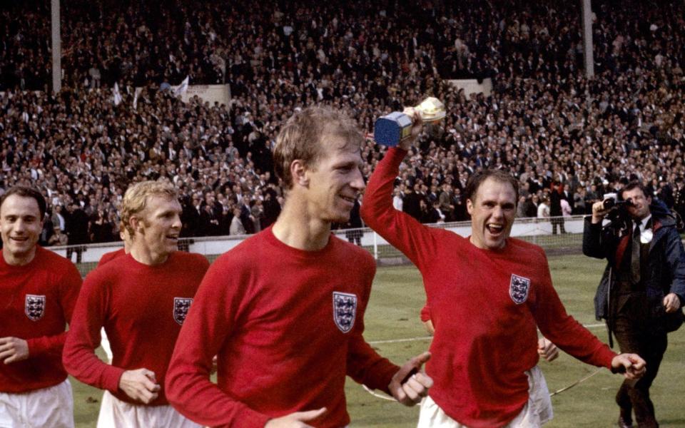 Jack Charlton (front centre) celebrates winning the 1966 World Cup with England - PA