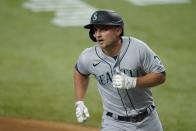 Seattle Mariners' Kyle Seager crosses the plate after hitting a two-run home run during the first inning of the team's baseball game against the Texas Rangers in Arlington, Texas, Saturday, July 31, 2021. (AP Photo/Tony Gutierrez)