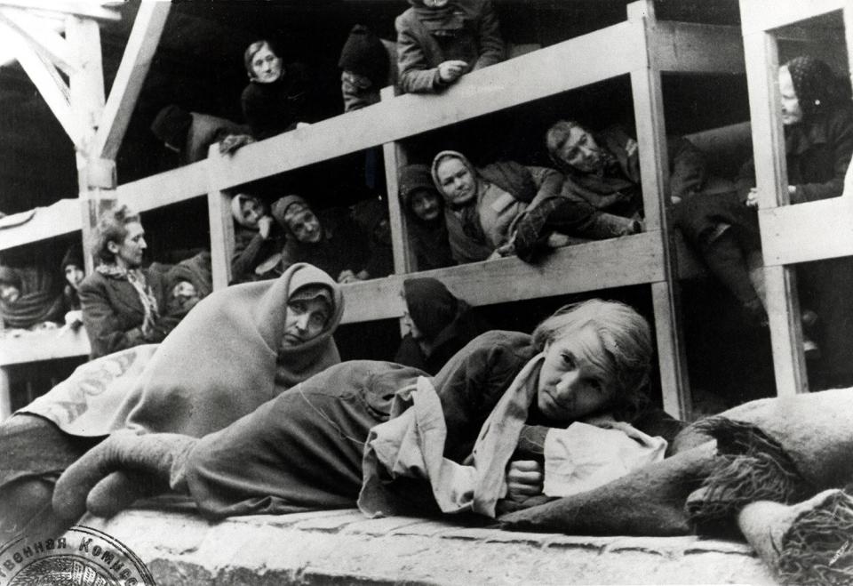 Pictured here, a group of women in the barracks, in a photo taken by a Russian photographer shortly after the camp's liberation. 