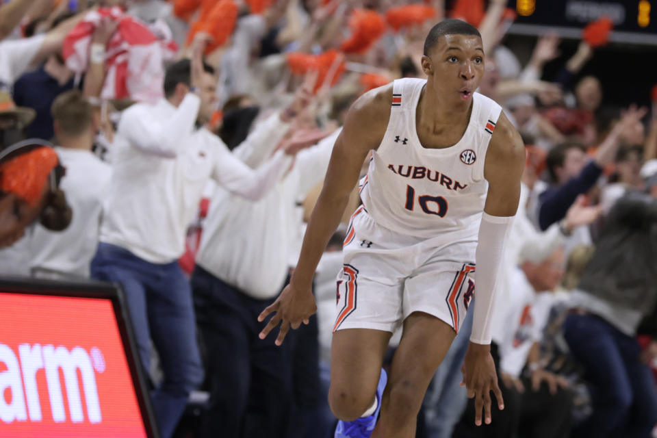 FILE - Auburn forward Jabari Smith (10) reacts after making a 3-pointer against Alabama during the first half of an NCAA college basketball game Tuesday, Feb. 1, 2022, in Auburn, Ala. Houston, Detroit and Orlando share the best odds to win the draft lottery on Tuesday, May 17, 2022, and the No. 1 pick in the NBA draft. All three are already loaded with young players, even before the possibility of adding someone like Chet Holmgren, Paolo Banchero or Jabari Smith. (AP Photo/Butch Dill, File)