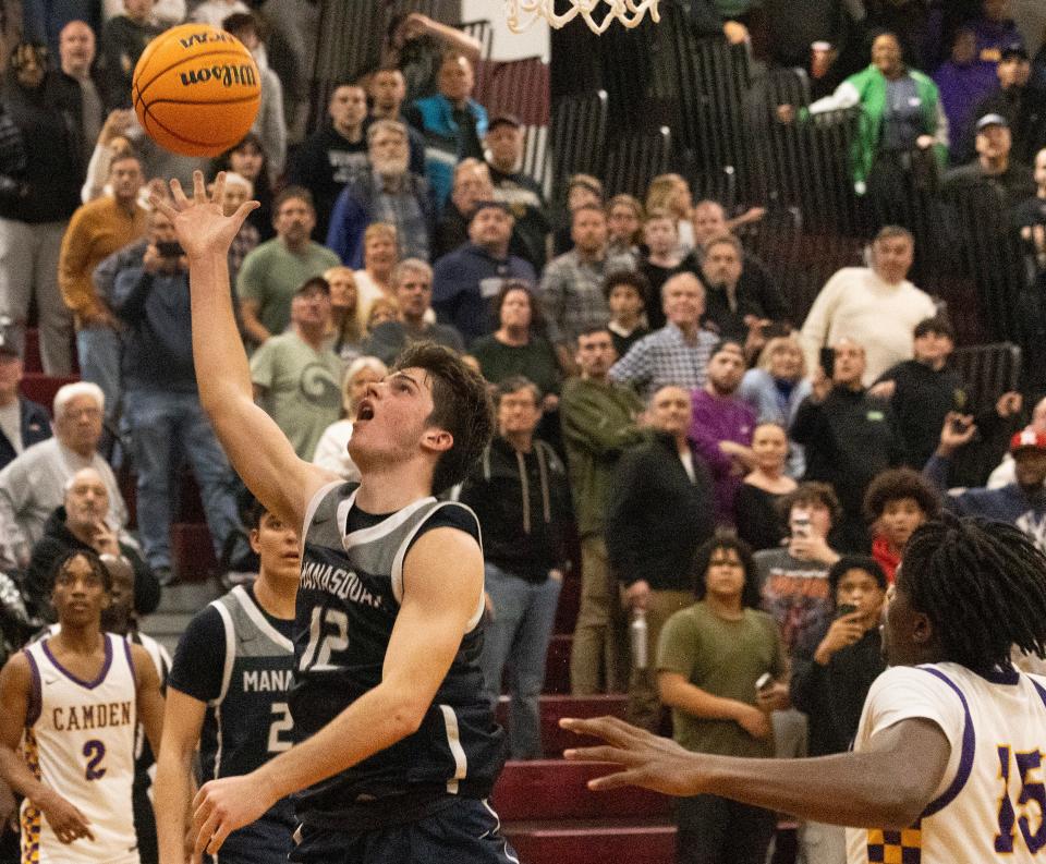 Mansquan’s Griffin Linstra puts in a game winning shot at the buzzer that was later called off by the referees. Manasquan Boys Basketball lose to Camden in NJSIAA Group 2 Semifinals in Berkeley Township, NJ on March 5, 2024.