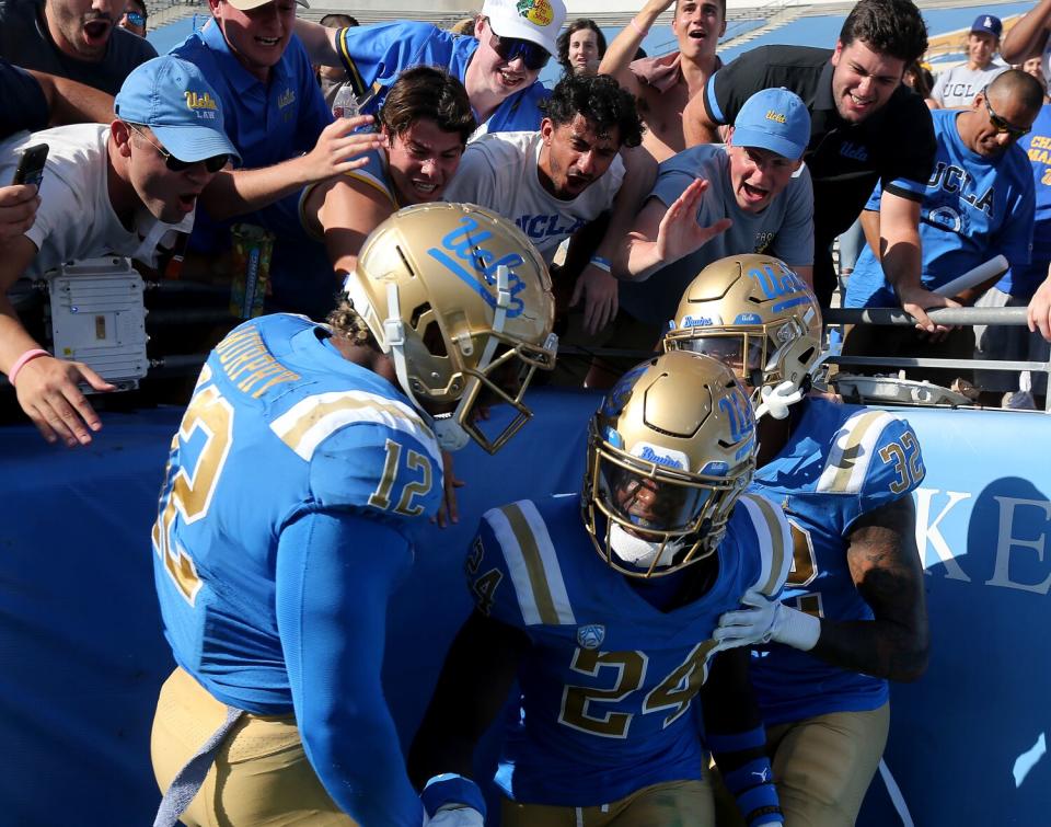 Fans and teammates congratulate UCLA cornerback Jaylin Davies