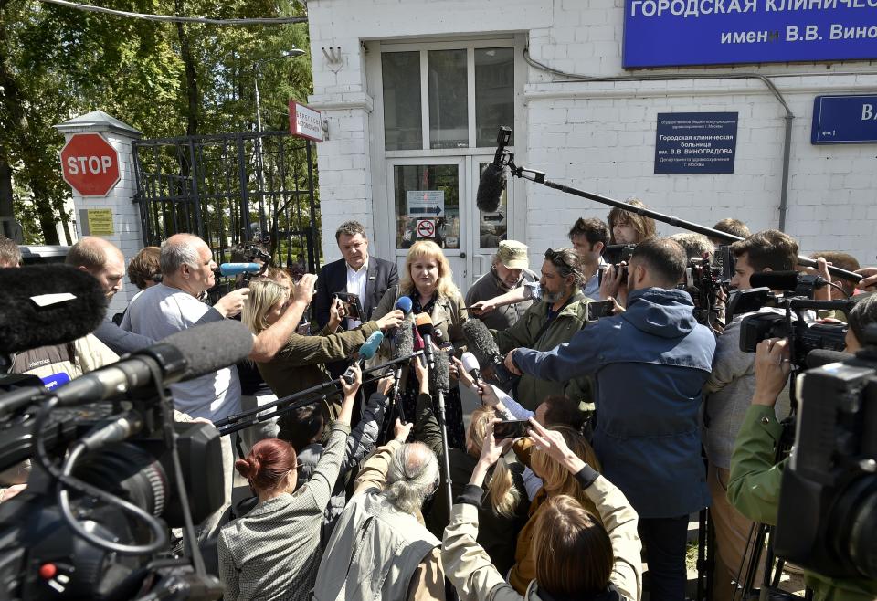 Journalists listen to Alexei Navalny's lawyer Olga Mikhailova, center, at a hospital where Russian opposition leader Alexei Navalny remains hospitalized, for a second day after his physician said he may have been poisoned, in Moscow, Russia, Monday, July 29, 2019. Details about Navalny's condition are scarce after Navalny was rushed to the hospital Sunday from a detention facility where he was serving a 30-day sentence for calling an unsanctioned protest. (AP Photo)