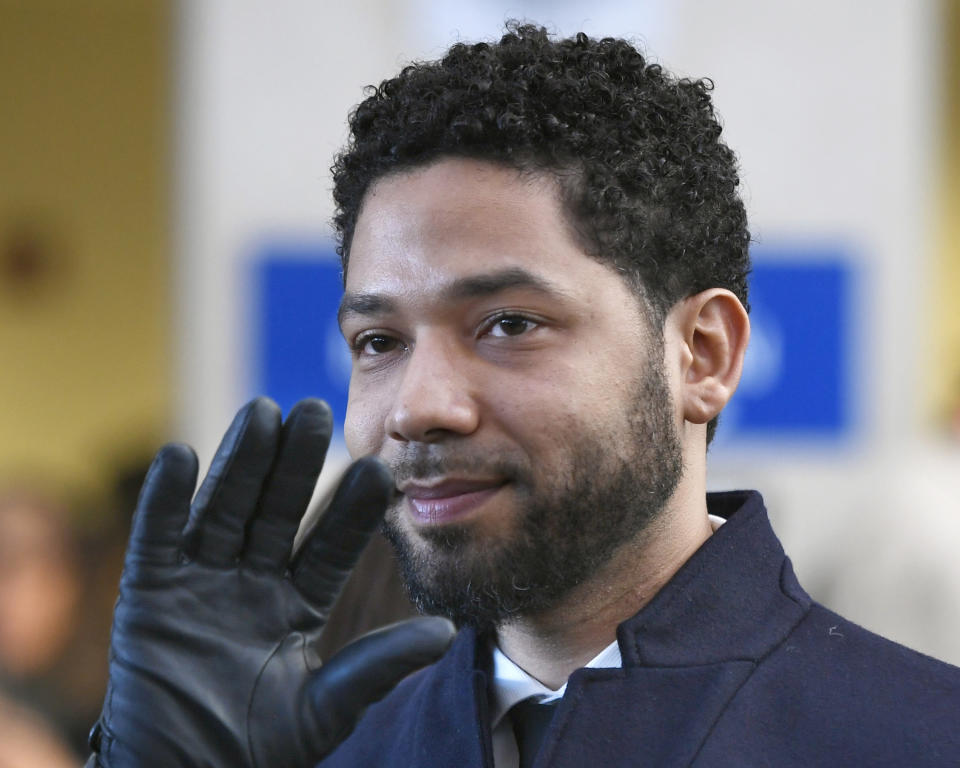 FILE - In this March 26, 2019, file photo, actor Jussie Smollett smiles and waves to supporters before leaving Cook County Court after his charges were dropped in Chicago. A special prosecutor in Chicago says Cook County State's Attorney Kim Foxx and her office abused their discretion in the case against actor Jussie Smollett but did nothing criminal. (AP Photo/Paul Beaty, File)