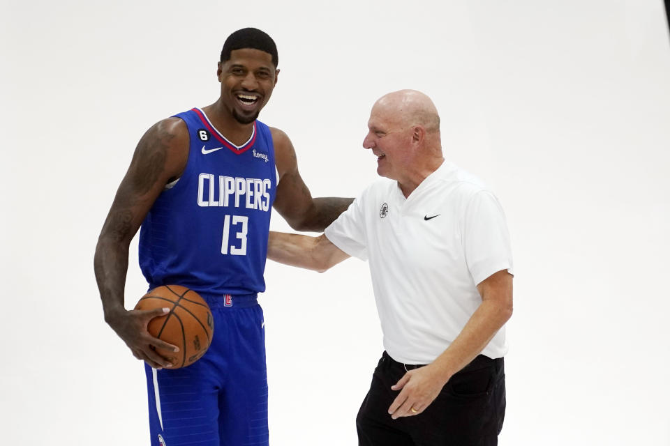 Los Angeles Clippers guard Paul George, left, smiles as he poses for photos with team owner Steve Ballmer during the NBA basketball team's Media Day, Monday, Sept. 26, 2022, in Los Angeles (AP Photo/Marcio Jose Sanchez)