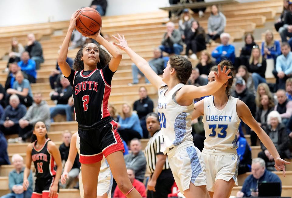 Westerville South's Deziah Dupree pulls up for a shot against Olentangy Liberty's Maria Stack.