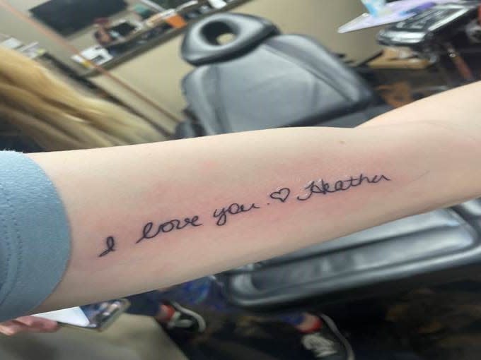 With the support of her mother, Sara Paulson, Kristen Camodeca, 19, recently chose to get a tattoo on her left arm. It bears words from the last note sent to her by her "bonus mom," Heather Dimmig, who died of cancer in 2021.