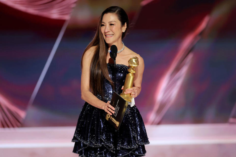 Michelle Yeoh accepts the Best Actress in a Motion Picture Musical or Comedy award on Jan. 10 in Beverly Hills, California.