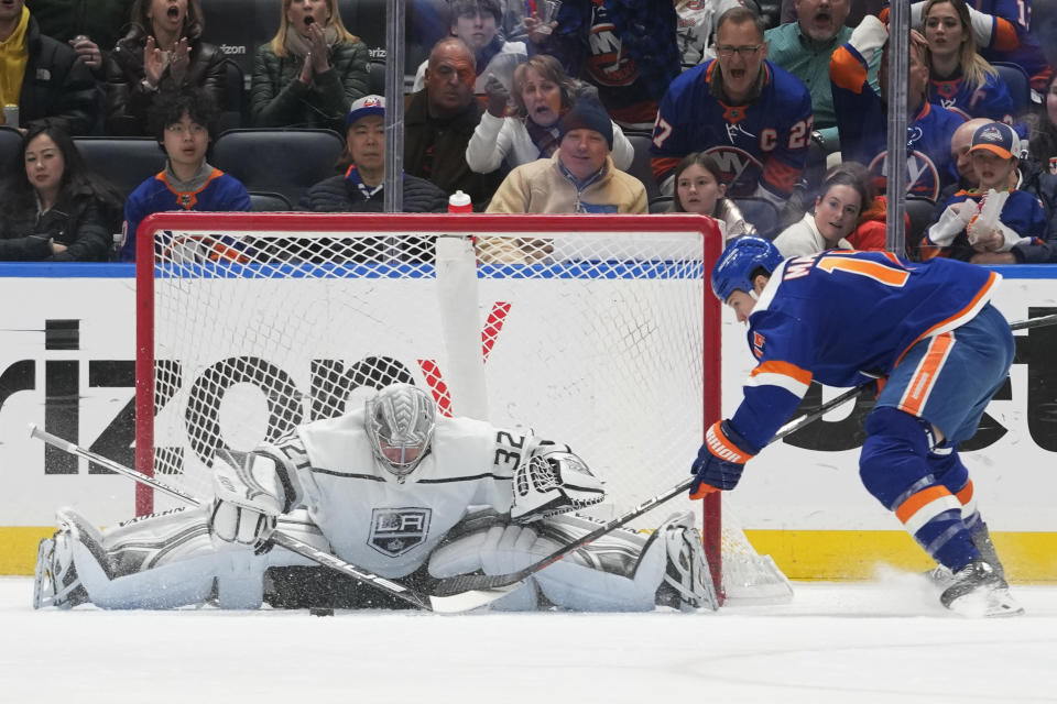 Los Angeles Kings goaltender Jonathan Quick (32) makes a save against New York Islanders left wing Matt Martin (17) during the first period of an NHL hockey game Friday, Feb. 24, 2023, in Elmont, N.Y. (AP Photo/Mary Altaffer)