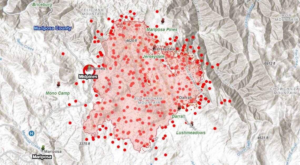 A map shows the perimeter of the Oak Fire northeast of Mariposa, California, as of Monday morning, July 25, 2022, estimated at about 17,000 acres. Red dots mark hot spots detected by infrared satellites.