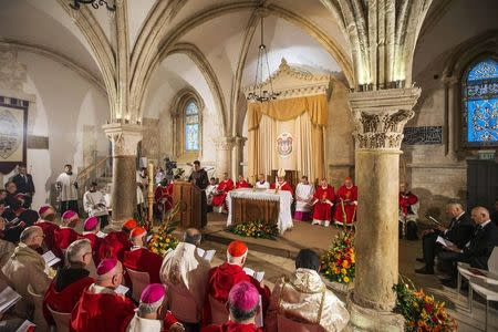 Clergymen attend a mass celebrated by Pope Francis (rear center) at the Cenacle, where Christian tradition says Jesus attended The Last Supper, on Mount Zion just outside Jerusalem's Old City May 26, 2014. REUTERS/Jack Guez