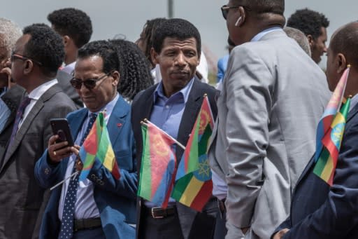 Ethiopia's retired double Olympic champion, Haile Gebrselassie, centre, was among those who welcomed the Eritrean delegation