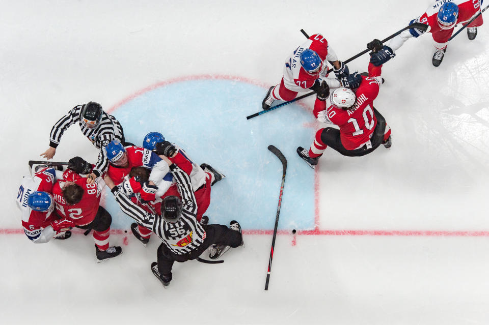 BRATISLAVA, SLOVAKIA - MAY 21: #64 Christoph Bertschy of Switzerland fights with #17 Filip Hronek of Czech Republic during the 2019 IIHF Ice Hockey World Championship Slovakia group game between Czech Republic and Switzerland at Ondrej Nepela Arena on May 21, 2019 in Bratislava, Slovakia. (Photo by RvS.Media/Robert Hradil/Getty Images)