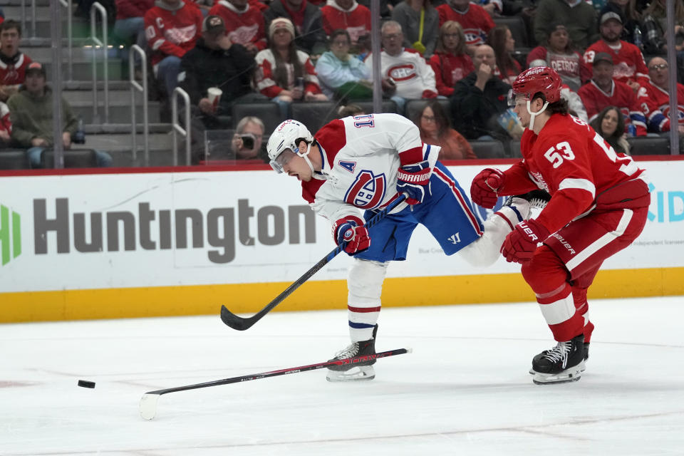 Montreal Canadiens right wing Brendan Gallagher (11) shoots as Detroit Red Wings' Moritz Seider (53) defends in the third period of an NHL hockey game Thursday, Nov. 9, 2023, in Detroit. (AP Photo/Paul Sancya)