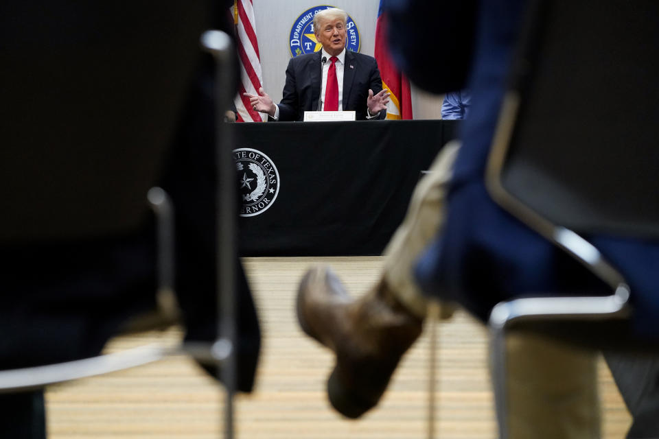 Former President Donald Trump attends a security briefing with Texas Governor Greg Abbott and state officials and law enforcement at the Weslaco Department of Public Safety DPS Headquarters before touring the US-Mexico border wall on Wednesday, June 30, 2021 in Weslaco, Texas. Trump was invited to South Texas by Abbott, who has taken up Trump's immigration mantle by vowing to continue building the border wall.(Jabin Botsford/The Washington Post via AP, Pool)