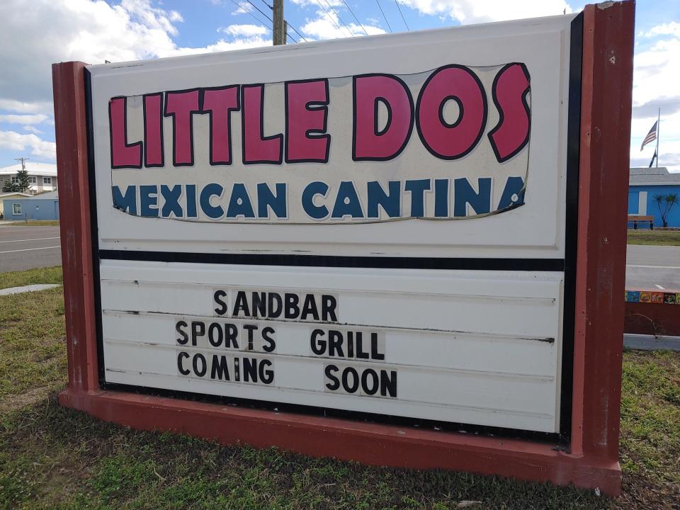 A sign in front of the former Little Dos Mexican Cantina in Satellite Beach says Sandbar Sports Grill is coming soon.