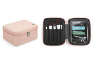 <p>The cult-favorite brand responsible for the recent hard-case luggage renaissance just launched its first-ever bag designed specifically for toting beauty items. </p> <p>The water-resistant nylon design is available in two colors, black and petal pink. The boxy design has a vintage feel and contains a detachable makeup brush roll inside the top lid and transparent pockets for easy organization and access on the go. </p> <p>For larger toiletries, Away also offers a multi-compartment <a href="https://www.awaytravel.com/accessories/large-toiletry-bag" rel="nofollow noopener" target="_blank" data-ylk="slk:hanging case with removable pouches;elm:context_link;itc:0;sec:content-canvas" class="link ">hanging case with removable pouches</a>.</p> <p><strong>Buy It!</strong> $75; <a href="https://www.awaytravel.com/shop/travel-bags" rel="nofollow noopener" target="_blank" data-ylk="slk:awaytravel.com;elm:context_link;itc:0;sec:content-canvas" class="link ">awaytravel.com</a></p>