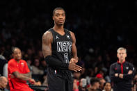 Brooklyn Nets' Lonnie Walker IV (8) checks in during the first half of an NBA basketball game against the Chicago Bulls in New York, Friday, March 29, 2024. (AP Photo/Peter K. Afriyie)