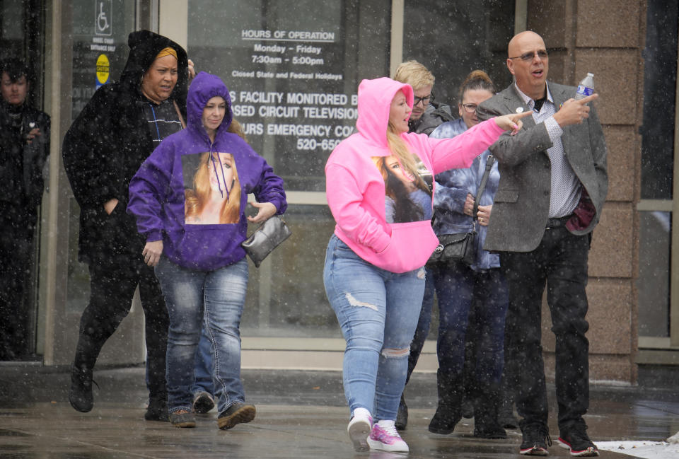 Matthew Haynes, front right, co-owner of Club Q, walks with a group out of the El Paso County courthouse during the lunch break in a preliminary hearing for the alleged shooter in the Club Q mass shooting Wednesday, Feb. 22, 2023, in Colorado Springs, Colo. (AP Photo/David Zalubowski)