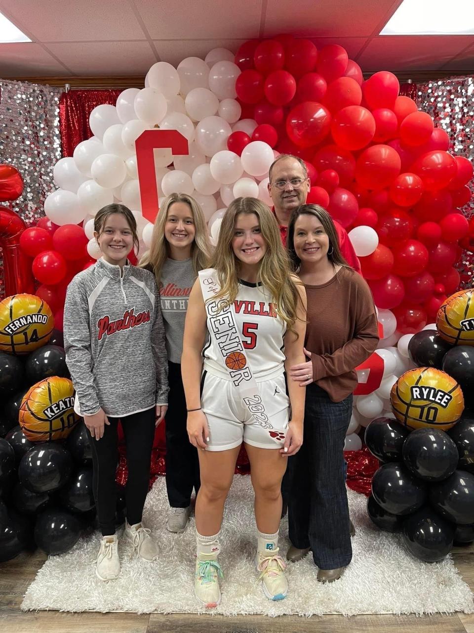 Collinsville High School senior Sophie Wills, center, celebrates Basketball Senior Night with, from left, her sisters, Bella and Lily Wills, and her parents, Chad and Cory Wills, in early 2023 in Collinsville, Alabama.