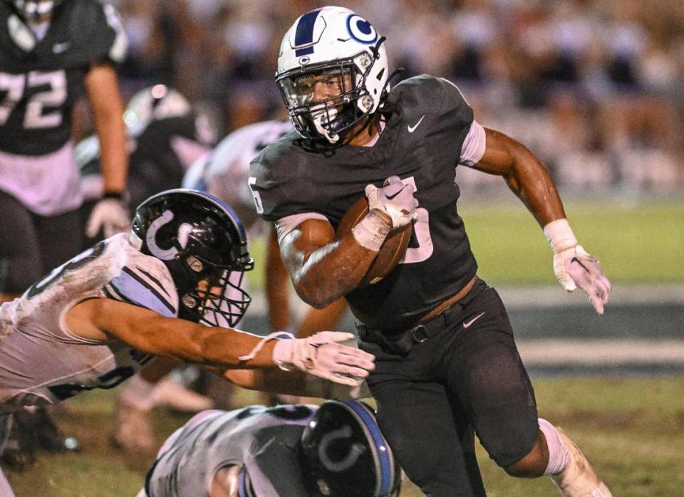 Central Valley Christian’s Bryson Donelson runs past the Clovis North defense during their game at CVC on Friday, Sept. 8, 2023.