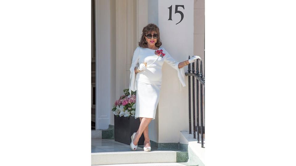 Joan Collins outside her London home