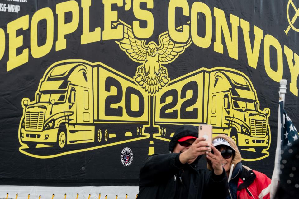 Attendees take a selfie at the People's Convoy rally, a movement opposing COVID-19 mandates, in Adelanto Stadium in Adelanto on Wednesday, Feb. 23, 2022.