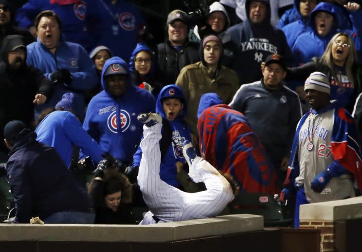 Chicago Cubs left fielder Kyle Schwarber catches a fly ball by New York Yankees' Chase Headley in foul territory during the 12th inning of an interleague baseball game Sunday, May 7, 2017 in Chicago. (AP Photo/Nam Y. Huh)