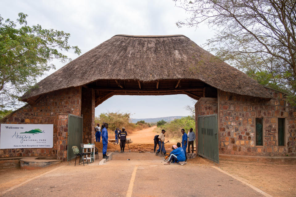 Workers spruce up the entrance of Akagera National Park in Rwanda. The park is a two-hour drive from the capital city of Kigali. (Photo: Bryan Kow)