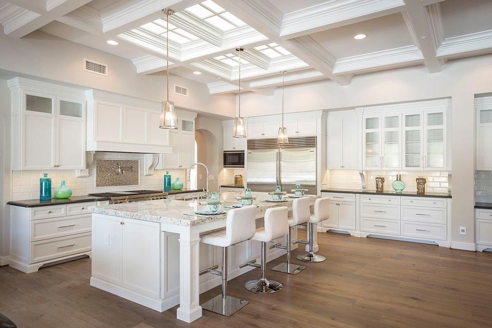 <p>​The kitchen is notably large (hey, when you're the world's fastest swimmer, you probably get pretty hungry). It is crafted with European stone and boasts imported hardwood floors. </p>