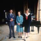 <p>Prince Charles, Queen Elizabeth, and Princess Diana pose in the Music Room of the palace months before Charles and Diana's wedding. When Diana passed away in 1997, <a href="https://www.rct.uk/collection/themes/exhibitions/royal-gifts/buckingham-palace/tribute-to-diana-princess-of-wales" rel="nofollow noopener" target="_blank" data-ylk="slk:a tribute;elm:context_link;itc:0;sec:content-canvas" class="link ">a tribute</a> was set up for her in the very same room.</p>