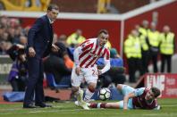 <p>Stoke City’s Xherdan Shaqiri in action with West Ham United’s Havard Nordtveit as West Ham United manager Slaven Bilic looks on </p>