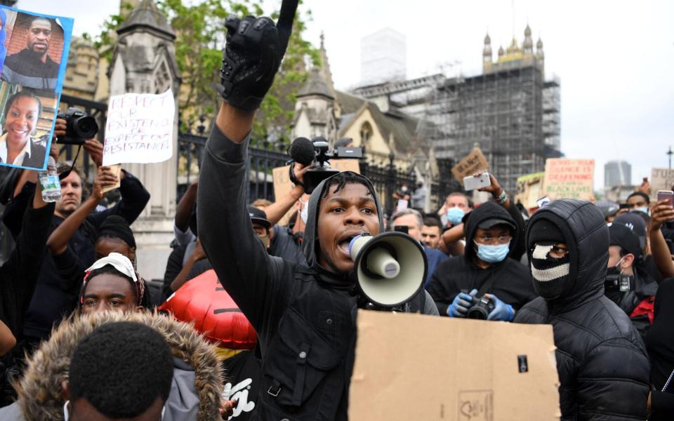 John Boyega speaks to protestors in Parliament square during an anti-racism demonstration in London, on June 3 - AFP