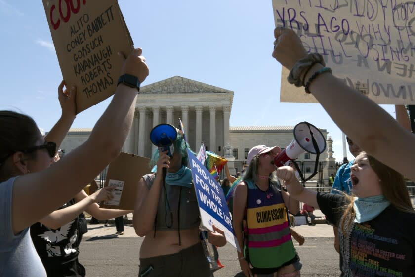 Anti-abortion demonstrators and abortion right activists protest outside the Supreme Court in Washington, Saturday, June 25, 2022. The Supreme Court has ended constitutional protections for abortion that had been in place nearly 50 years, a decision by its conservative majority to overturn the court's landmark abortion cases. (AP Photo/Jose Luis Magana)