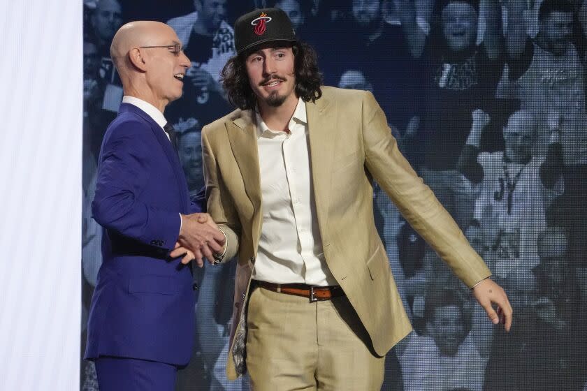 Jaime Jaquez Jr. greets NBA Commissioner Adam Silver.