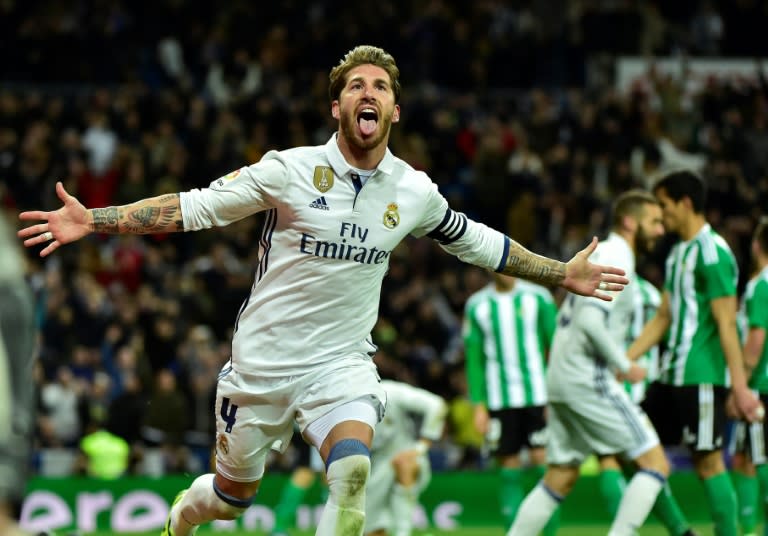 Real Madrid's defender Sergio Ramos celebrates after scoring a goal during the Spanish league footbal match Real Madrid CF vs Real Betis at the Santiago Bernabeu stadium in Madrid on March 12, 2017