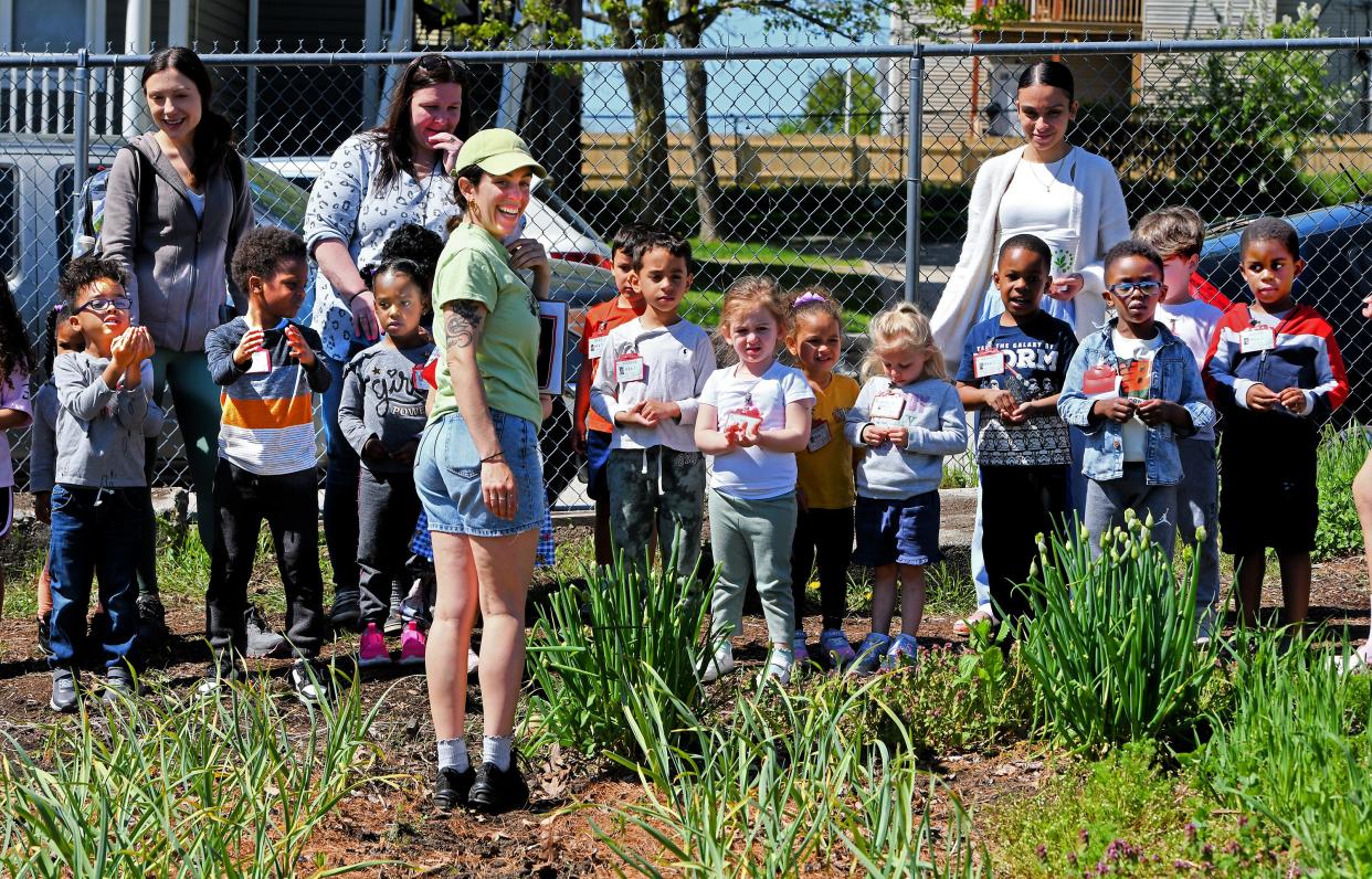 Regional Environment Council School Gardens Coordinator Eliza Lawrence talks about the garlic patch as over 250 preschool students enrolled in the Worcester Head Start program have a field trip at the REC YouthGROW Farm.