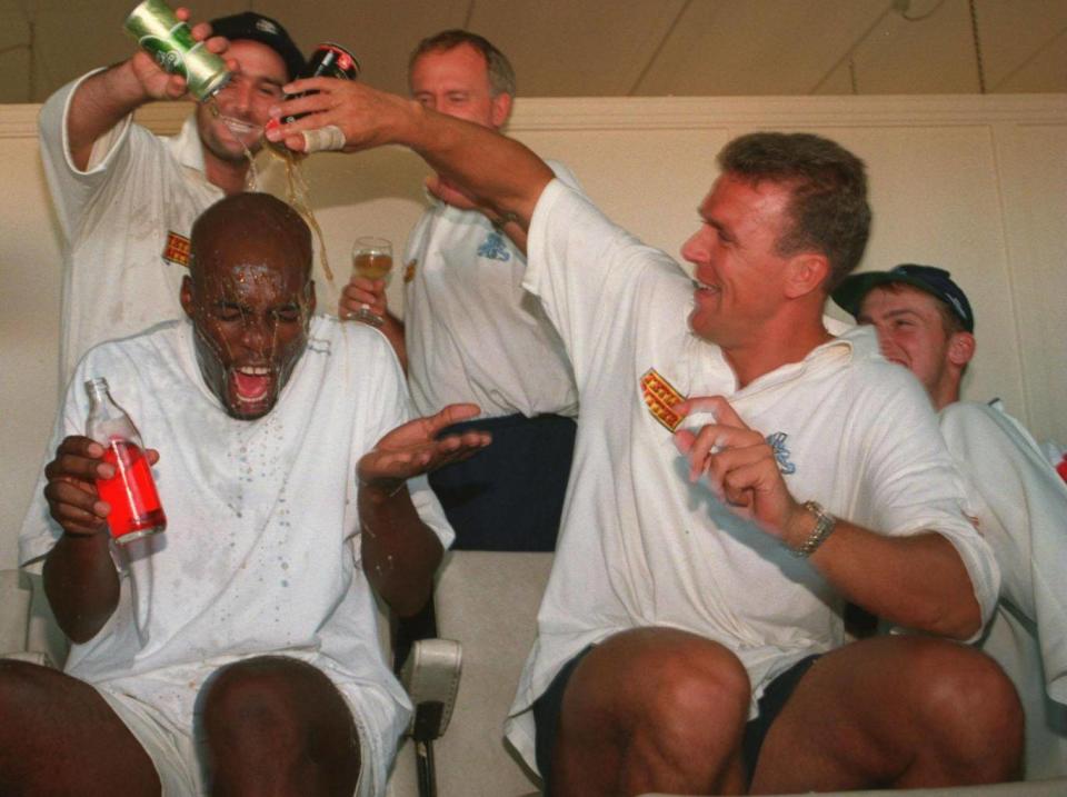 Alec Stewart and Graham Thorpe soak Chris Lewis after winning in Adelaide (Getty Images)