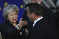 British Prime Minister Theresa May, left, speaks with Luxembourg's Prime Minister Xavier Bettel as she arrives for an EU summit at the Europa building in Brussels, Thursday, Dec. 13, 2018. EU leaders gather for a two-day summit, beginning Thursday, which will center on the Brexit negotiations. (AP Photo/Francisco Seco)