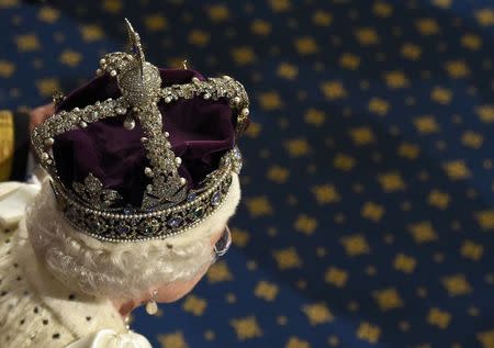 Britain's Queen Elizabeth proceeds through the Royal Gallery as she leaves after the State Opening of Parliament in the House of Lords, at the Palace of Westminster in London, Britain May 18, 2016. REUTERS/Toby Melville