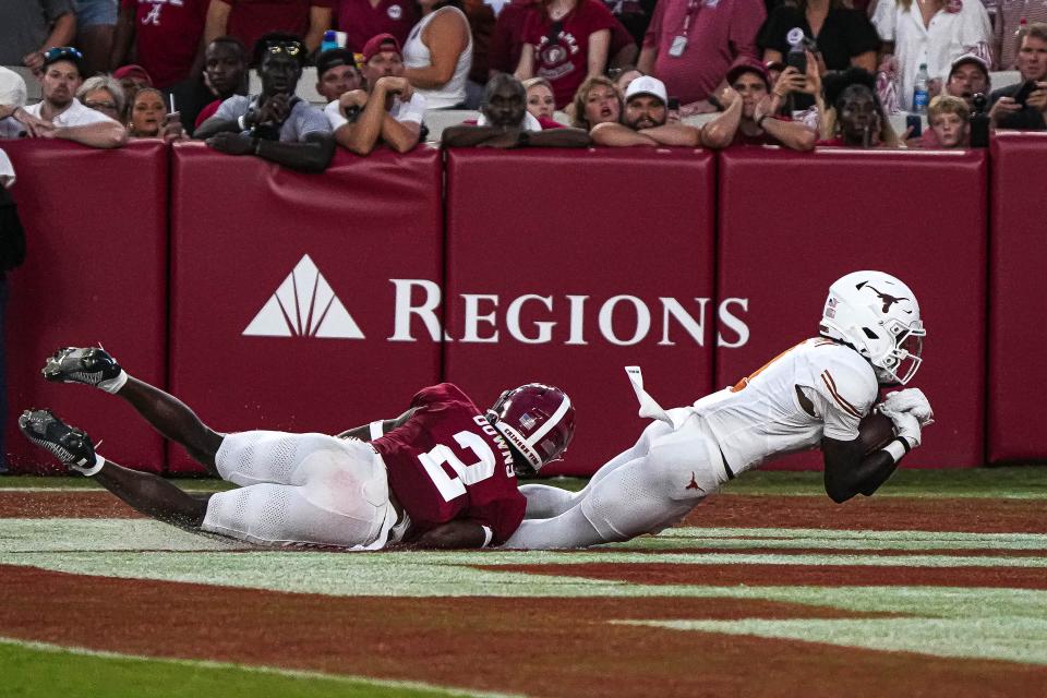 Texas wide receiver Xavier Worthy scores a touchdown against Alabama. The Longhorns' 34-24 win vaulted them from No. 11 to No. 4 in this week's Associated Press Top 25 poll.