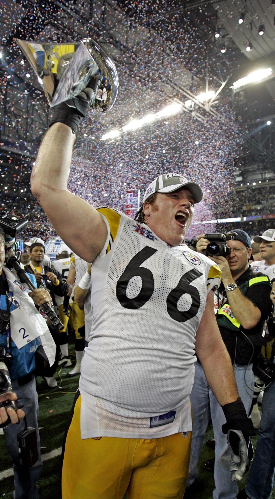 FILE - In this Feb. 5, 2006, file photo, Pittsburgh Steelers' Alan Faneca holds up the Vince Lombardi Trophy after defeating the Seattle Seahawks in the Super Bowl 15 football game in Detroit. The most memorable example of Faneca's brilliant blocking and dominance up front came on football's biggest stage in February 2006 during Pittsburgh's 21-10 victory over Seattle in the Super Bowl. Faneca was elected to the Pro Football Hall of Fame in his sixth year of eligibility and it is an honor that many believe was a long time coming. (AP Photo/Michael Conroy, File)