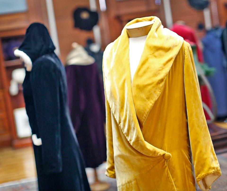 This gold rayon velvet opera or evening coat, with a luxurious texture and light-reflecting properties, is from the 1920s. The Cohasset Historical Society exhibit "Baby, It's Cold Outside" features women's capes, coats and winterwear. Wednesday, Jan. 17, 2024.